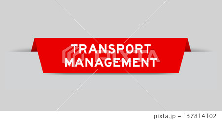 Red color inserted label with word transport management on gray background 137814102