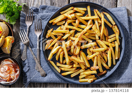 Crispy french fries on a plate with dipping sauce Crispy french fries on a plate with dipping sauce 137814118