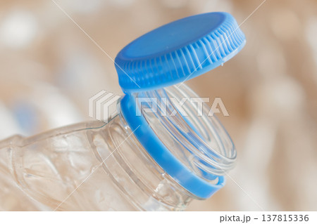 tethered plastic bottle cap innovation: new design ensures caps are recycled with the container tethered plastic bottle cap innovation: new design ensures caps are recycled with the container 137815336