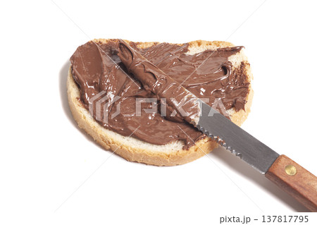 chocolate-nut paste spread on bread with knife, chocolate-nut paste spread on bread with knife, 137817795