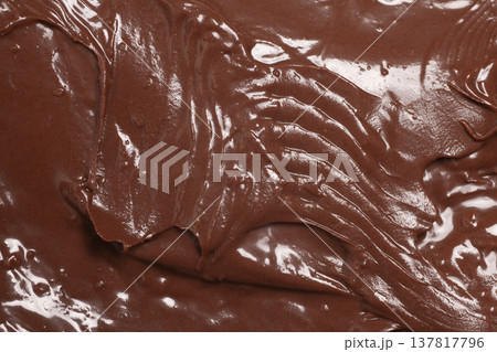 Chocolate nut paste as background, texture,macro. Chocolate nut paste as background, texture,macro. 137817796