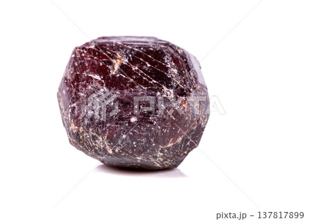 Macro of a mineral garnet stone on a white background Macro of a mineral garnet stone on a white background 137817899