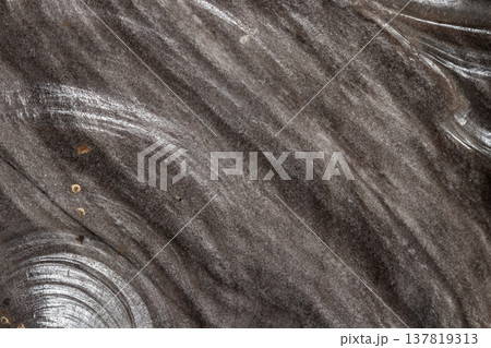 Macro stone mineral obsidian on a black background 137819313