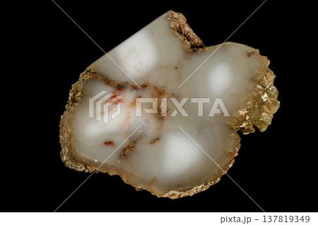 Macro stone Cacholong on parade on black background Macro stone Cacholong on parade on black background 137819349