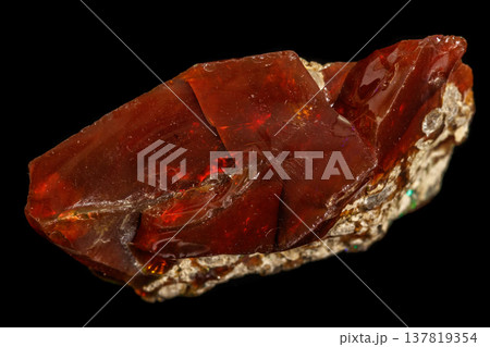 Macro stone Opal mineral in rock on a black background 137819354