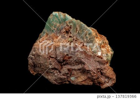 Macro of a stone Chrysoprase mineral on a black background 137819366