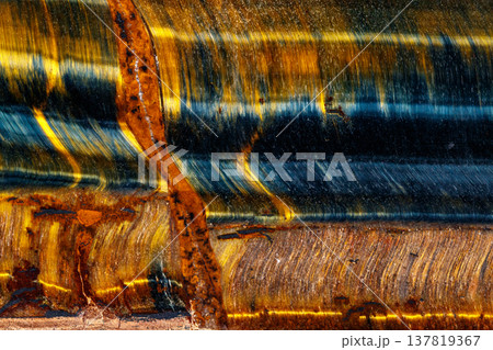 Quartz eye macro stone tiger eye on a black background Quartz eye macro stone tiger eye on a black background 137819367