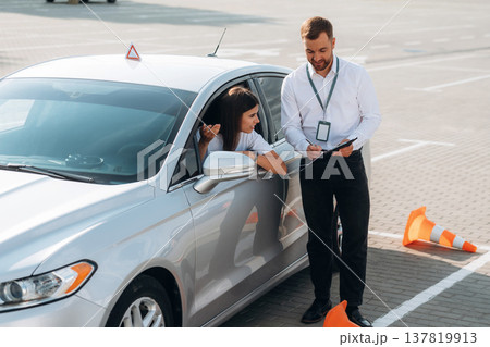 Woman is trying to pass exam in the driving school Woman is trying to pass exam in the driving school 137819913