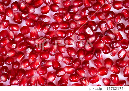 Abstract pomegranate seeds pattern creating vivid texture and contrast, repeated surface mosaic ideal for backgrounds, wallpaper and creative packaging with saturated red tones Abstract pomegranate seeds pattern creating vivid texture and contrast, repeated surface mosaic ideal for backgrounds, wallpaper and creative packaging with saturated red tones 137821734