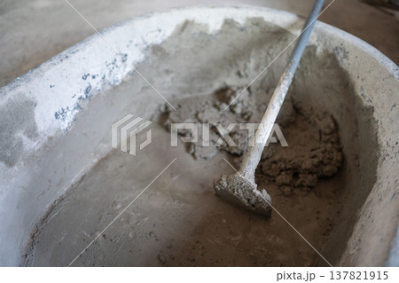 Mixing concrete for construction projects in urban areas industrial scene close-up view building foundations Mixing concrete for construction projects in urban areas industrial scene close-up view building foundations 137821915