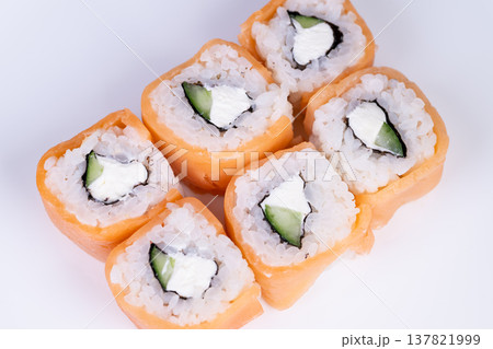 Overhead sushi presentation for social media. Neatly arranged sushi slices from above for culinary sharing. Topdown view of meticulously organized sushi rolls perfect for posting 137821999