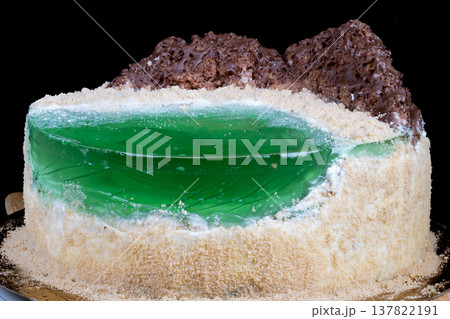 Baker preparing cake sample with visible jelly and crumb texture. Intimate kitchen scene showing baker preparing taste test of homemade cake with green jelly filling Baker preparing cake sample with visible jelly and crumb texture. Intimate kitchen scene showing baker preparing taste test of homemade cake with green jelly filling 137822191