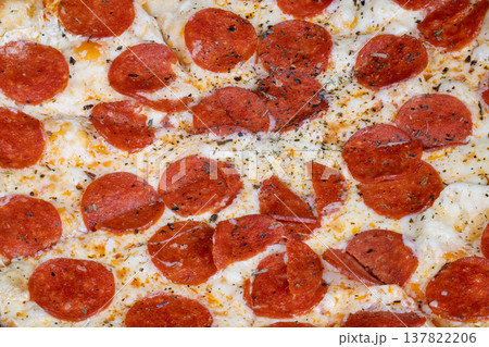 Delicious hot pizza. Crispy edged pizza topped with sizzling pepperoni slices. Steaming hot pepperoni pizza featuring charred crust and fragrant herbs ideal for promotion Delicious hot pizza. Crispy edged pizza topped with sizzling pepperoni slices. Steaming hot pepperoni pizza featuring charred crust and fragrant herbs ideal for promotion 137822206