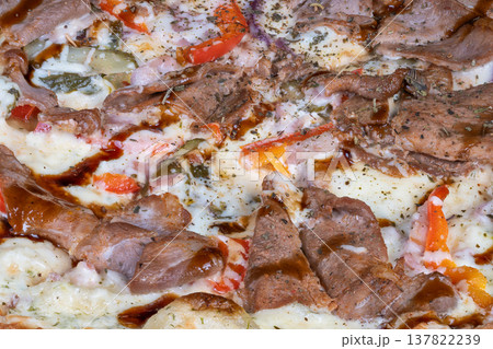 Savory pizza delight. Teriyaki drizzled cheesy beef pizza. Juicy beef slices on cheesy teriyaki crust. Flavorful pizza featuring tender beef and flavorful oregano topping Savory pizza delight. Teriyaki drizzled cheesy beef pizza. Juicy beef slices on cheesy teriyaki crust. Flavorful pizza featuring tender beef and flavorful oregano topping 137822239