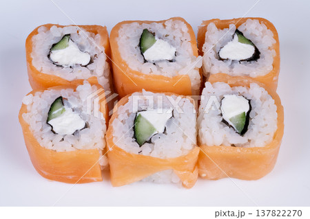Gourmet sushi rolls with precise cuts and elegant presentation, fine dining vibe, minimalist white plate, subtle shadowing, refined texture highlighting quality ingredients Gourmet sushi rolls with precise cuts and elegant presentation, fine dining vibe, minimalist white plate, subtle shadowing, refined texture highlighting quality ingredients 137822270
