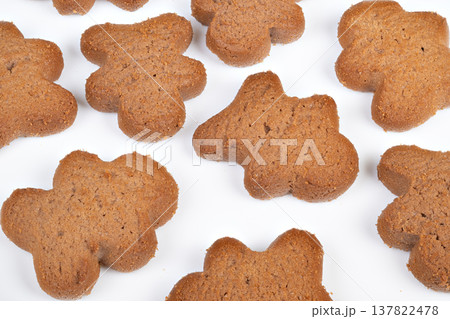 Snacks with grains. Natural light emphasizes texture of nutritious bread slices. Displaying wholesome cookies with textured grains on bright white background for meal options Snacks with grains. Natural light emphasizes texture of nutritious bread slices. Displaying wholesome cookies with textured grains on bright white background for meal options 137822478