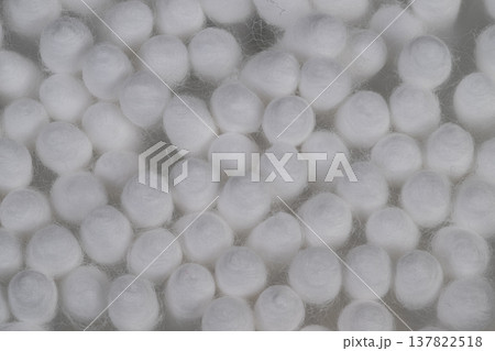Detailed soft fiber macro. Macro view of smooth white cotton swabs with shadows. Abstract pattern of tightly clustered cotton tips emphasizing purity and simplicity 137822518