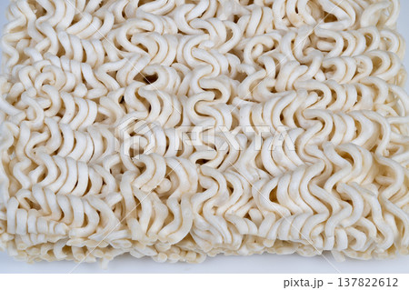 Dry instant noodles still life with minimalist styling, soft lighting and negative space, versatile for lifestyle editorials and social visuals about convenience food 137822612