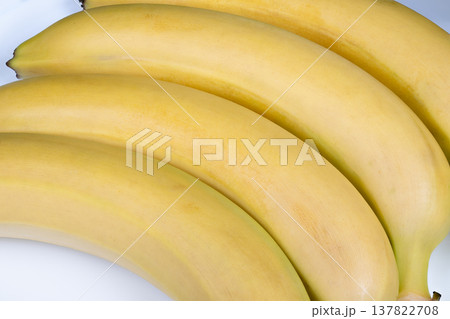 Banana smoothie ingredients. Use yellow bananas for delicious and creamy smoothies at home. Perfectly ripe bananas enhance texture and flavor of homemade smoothie beverages Banana smoothie ingredients. Use yellow bananas for delicious and creamy smoothies at home. Perfectly ripe bananas enhance texture and flavor of homemade smoothie beverages 137822708