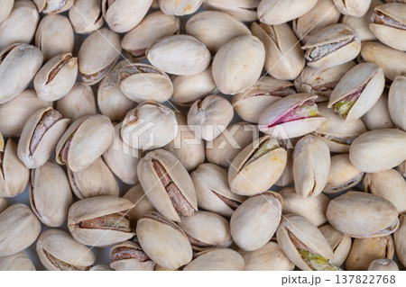 Closeup of handcrafted pistachios showcasing variety and premium appeal. Detailed image of artisan pistachios highlighting unique shells and kernels for luxury presentation 137822768