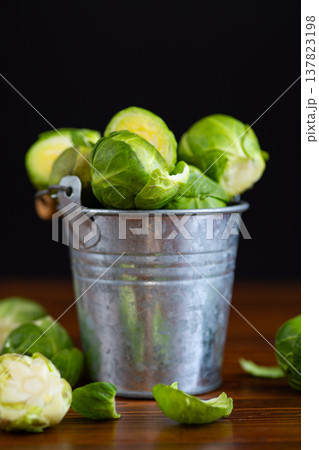 fresh brussels sprouts with parsley on wooden table fresh brussels sprouts with parsley on wooden table 137823198