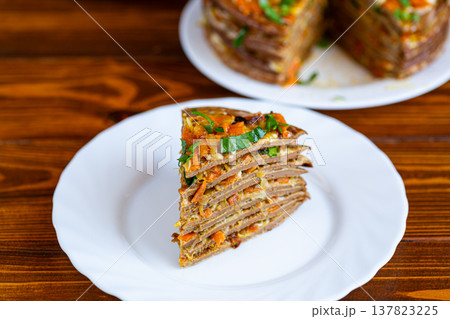 sliced liver cake with carrot onion filling and parsley topping sliced liver cake with carrot onion filling and parsley topping 137823225
