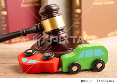 Car accident lawsuit and insurance, Judge hammer with car model. 137823305