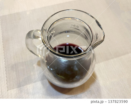 a wine jug isolated on the table 137823590