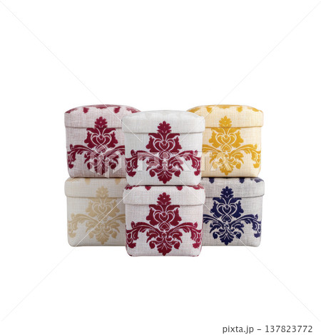 Collection of decorative fabric covered boxes with intricate floral patterns red, yellow, and blue, stacked artistic arrangement. These boxes are perfect for adding touch of elegance to any space 137823772