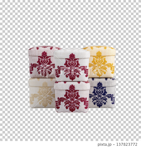 Collection of decorative fabric covered boxes with intricate floral patterns red, yellow, and blue, stacked artistic arrangement. These boxes are perfect for adding touch of elegance to any space 137823772