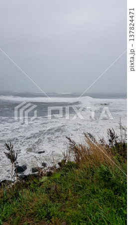 A view of a stormy sea from a rocky Kuril Islands coast 137824471