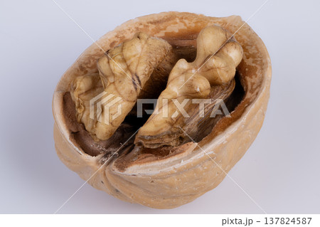Premium baking nut. Highquality walnut half suitable for baking and pastry decoration. Elegant single walnut slice showcasing natural oils and crunchy texture for culinary use Premium baking nut. Highquality walnut half suitable for baking and pastry decoration. Elegant single walnut slice showcasing natural oils and crunchy texture for culinary use 137824587