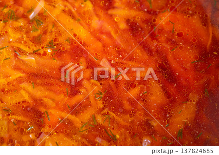 Warm hearty rustic beet and herb soup. Satisfying bowl of colorful vegetable and beet soup. Delicious traditional beet soup served with fresh herbs and vibrant vegetables Warm hearty rustic beet and herb soup. Satisfying bowl of colorful vegetable and beet soup. Delicious traditional beet soup served with fresh herbs and vibrant vegetables 137824685