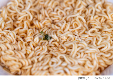 Noodle surface pattern. Highresolution seamless image of flavored instant noodles surface. Vivid topdown view of textured instant noodles ideal for packaging and backgrounds 137824788