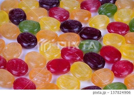 Premium confection photography emphasizing vibrant colors and fine details. Artistic macro image capturing intricate surface and luminous shine of gourmet candy classifications 137824906