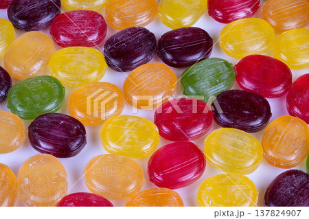 Bright and cheerful snack made from natural fruit flavors. Vivid assortment of fruitinspired candies featuring tangy citrus and berry flavors for seasonal cooking 137824907