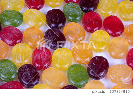Massive colorful sweets conveyor belt. Production line with vibrant candies and machinery. Large scale confectionery production with assorted sweets and equipment Massive colorful sweets conveyor belt. Production line with vibrant candies and machinery. Large scale confectionery production with assorted sweets and equipment 137824910