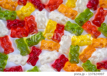Bright gummy nostalgia. Colorful sweets bring back joyful childhood moments. Vibrant assortment of gummy candies sparks nostalgic feelings and playful brand imagery Bright gummy nostalgia. Colorful sweets bring back joyful childhood moments. Vibrant assortment of gummy candies sparks nostalgic feelings and playful brand imagery 137824997