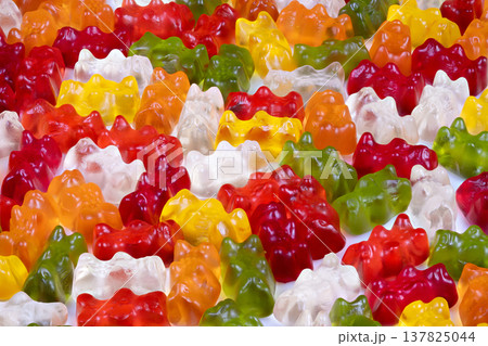 Vibrant gummy display. Bright assorted gummies showcased attractively for shoppers. An eyecatching collection of multicolored gummy candies designed to attract customer attention Vibrant gummy display. Bright assorted gummies showcased attractively for shoppers. An eyecatching collection of multicolored gummy candies designed to attract customer attention 137825044
