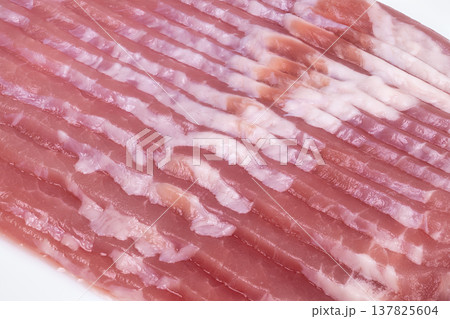 Factorystyle bacon with consistent slices and packaging. Manufacturinggrade bacon sheet with parallel slices ideal for streamlined production and packaging processes Factorystyle bacon with consistent slices and packaging. Manufacturinggrade bacon sheet with parallel slices ideal for streamlined production and packaging processes 137825604