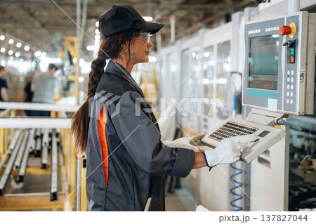 Using the terminal. Woman is in the window making factory 137827044