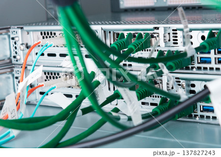 Fiber Optic cables connected to optic ports, network cables conn 137827243