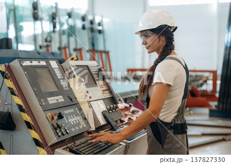 Woman is in the window making factory 137827330
