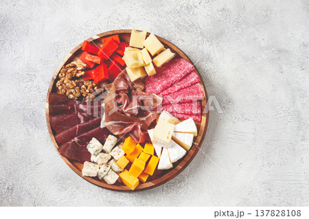 assortment of cheese meat cuts, on a plate, top view, no people, 137828108