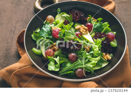 Fresh salad,waldorf. celery stalk, with apple and walnut, grapes, herbs, homemade, no people 137828144