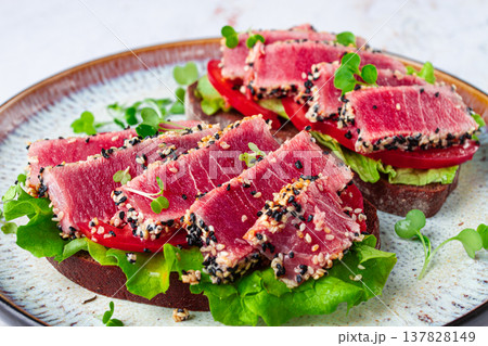 sandwiches with fried tuna fillet in sesame seeds, breakfast, top view, homemade, sandwiches with fried tuna fillet in sesame seeds, breakfast, top view, homemade, 137828149