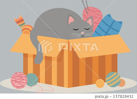 Domestic kitten resting in a box filled with bright yarn. PNG Domestic kitten resting in a box filled with bright yarn. PNG 137828432