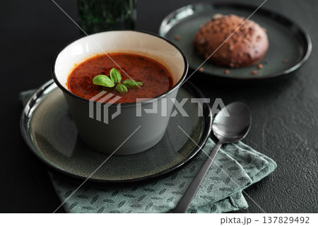 Bowl of homemade red bean soup on dark wooden table. Front view Bowl of homemade red bean soup on dark wooden table. Front view 137829492