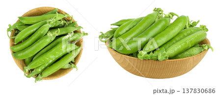 Fresh green peas fresh peas in pods in a wooden bowl isolated on white background. Top view. Flat lay 137830686