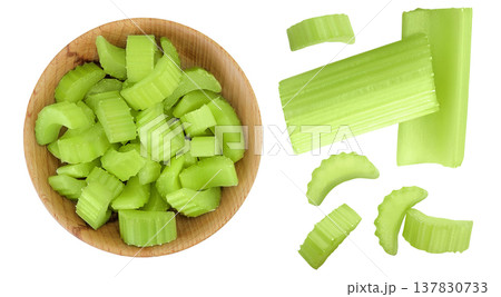fresh celery in wooden bowl isolated on white background. Top view. Flat lay 137830733